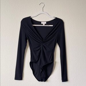Topshop black ribbed twist-front long-sleeve bodysuit. Size US6, NWOT